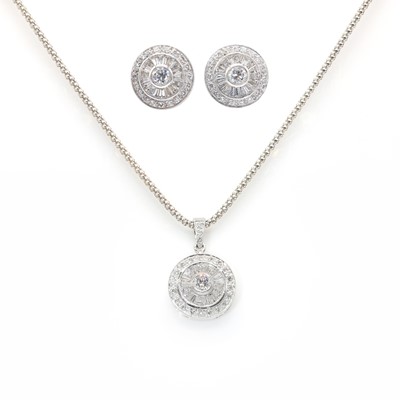 Lot 251 - A white gold diamond set target pendant and earring suite