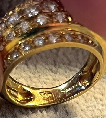 Lot 70 - An 18ct gold and diamond five row bombé ring, by Garrard & Co.