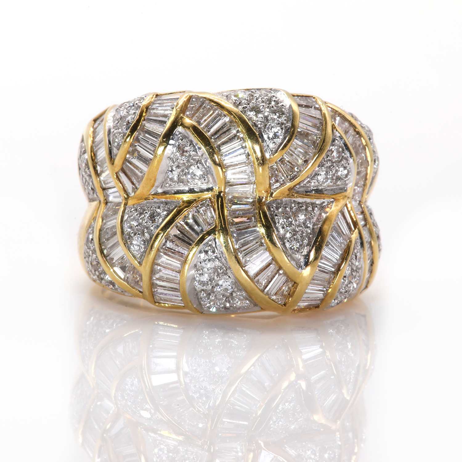 Lot 76 - A vari-cut diamond set two row bombé ring