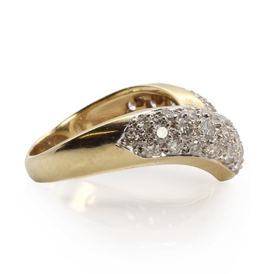 Lot 1059 - A gold diamond set wishbone ring