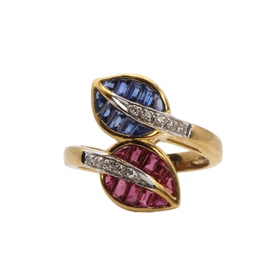 Lot 1128 - A ruby, sapphire and diamond crossover ring