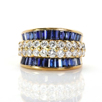 Lot 158 - A gold, calibré cut sapphire and diamond ring