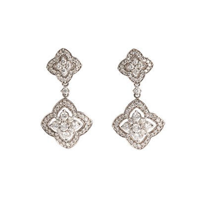 Lot 1091 - A pair of white gold diamond clover design drop earrings
