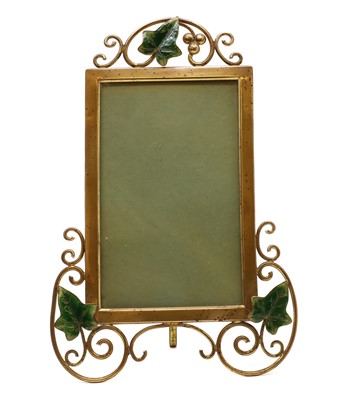 Lot 328 - A brass and enamelled photograph frame