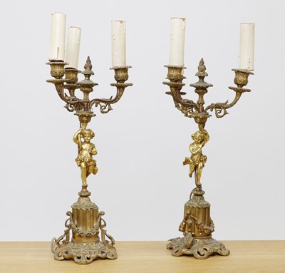 Lot 238 - A pair of gilt metal candelabra