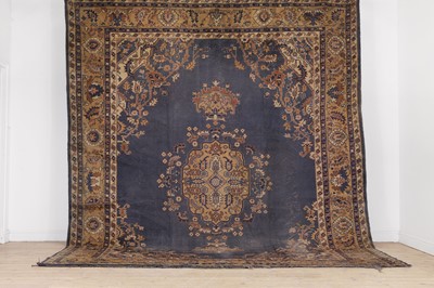 Lot 208 - A wool carpet of Heriz design