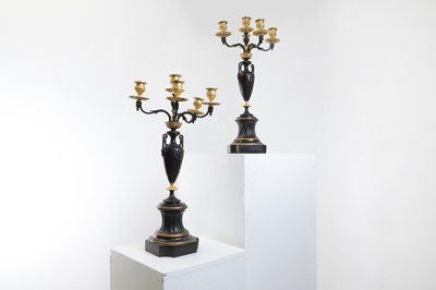 Lot 238 - A pair of neoclassical-style patinated bronze and ormolu-mounted candelabra