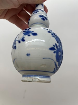 Lot 128 - A Chinese blue and white double gourd vase