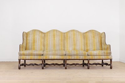 Lot 87 - A pair of Louis XV walnut sofas