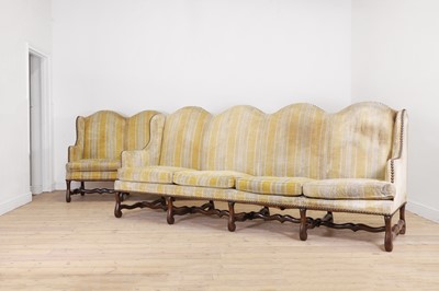 Lot 87 - A pair of Louis XV walnut sofas