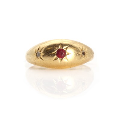 Lot 1029 - An 18ct gold three stone ruby and diamond star set gypsy ring
