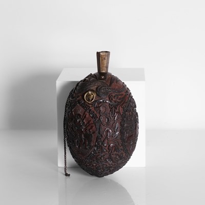Lot 2 - A carved coconut 'bugbear' flask