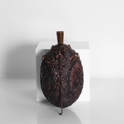 Lot 2 - A carved coconut 'bugbear' flask