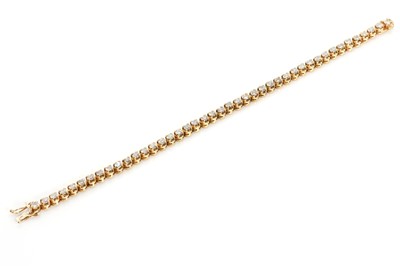 Lot 93 - An 18ct gold diamond line bracelet