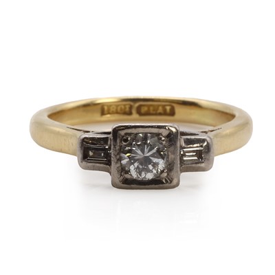 Lot 1087 - A gold and platinum round brilliant cut diamond ring with baguette diamond accents