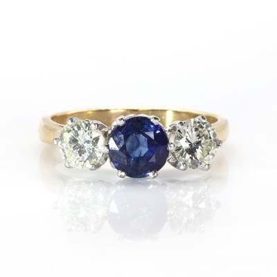 Lot 156 - An 18ct gold sapphire and diamond three stone ring