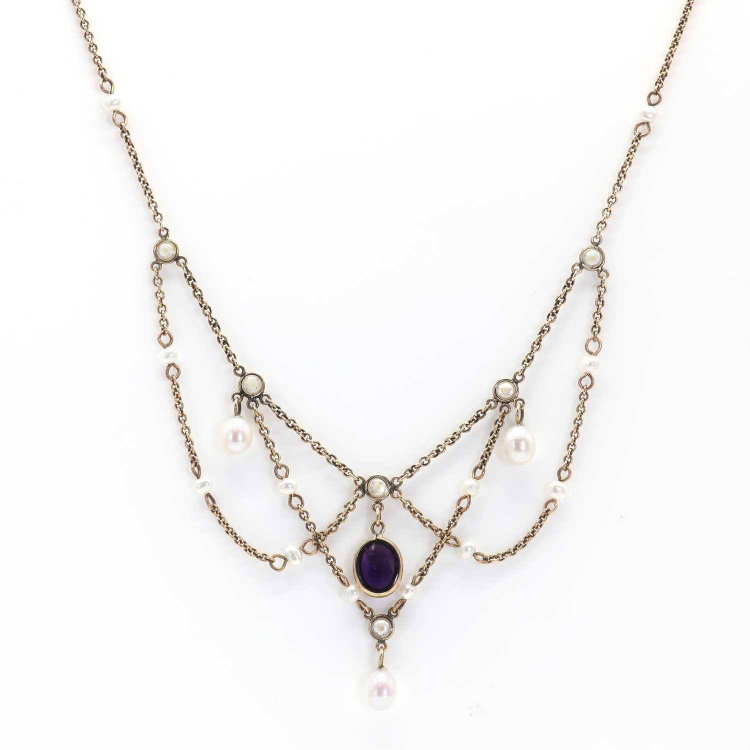 Lot 30 - A 9ct gold seed pearl and amethyst festoon necklace