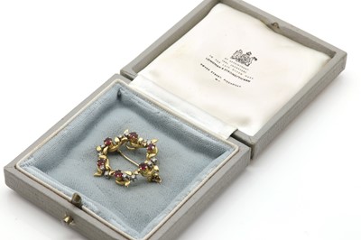 Lot 78 - An 18ct gold ruby and diamond openwork brooch