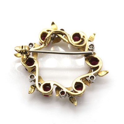 Lot 78 - An 18ct gold ruby and diamond openwork brooch