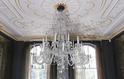 Lot 493 - A cut and moulded crystal glass twenty-light chandelier in the manner of Baccarat