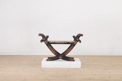 Lot 308 - A Regency-style ebonised and parcel-gilt stool