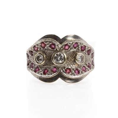 Lot 66 - A white gold ruby and diamond bow shaped ring