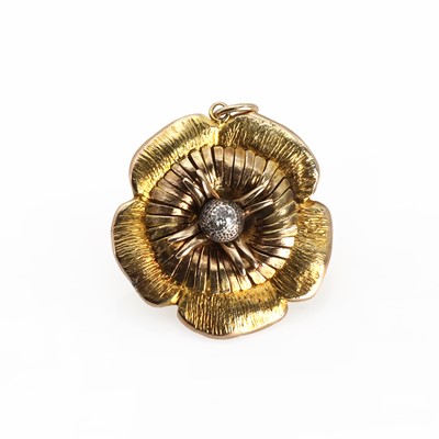 Lot 1199 - A gold diamond flower head pendant