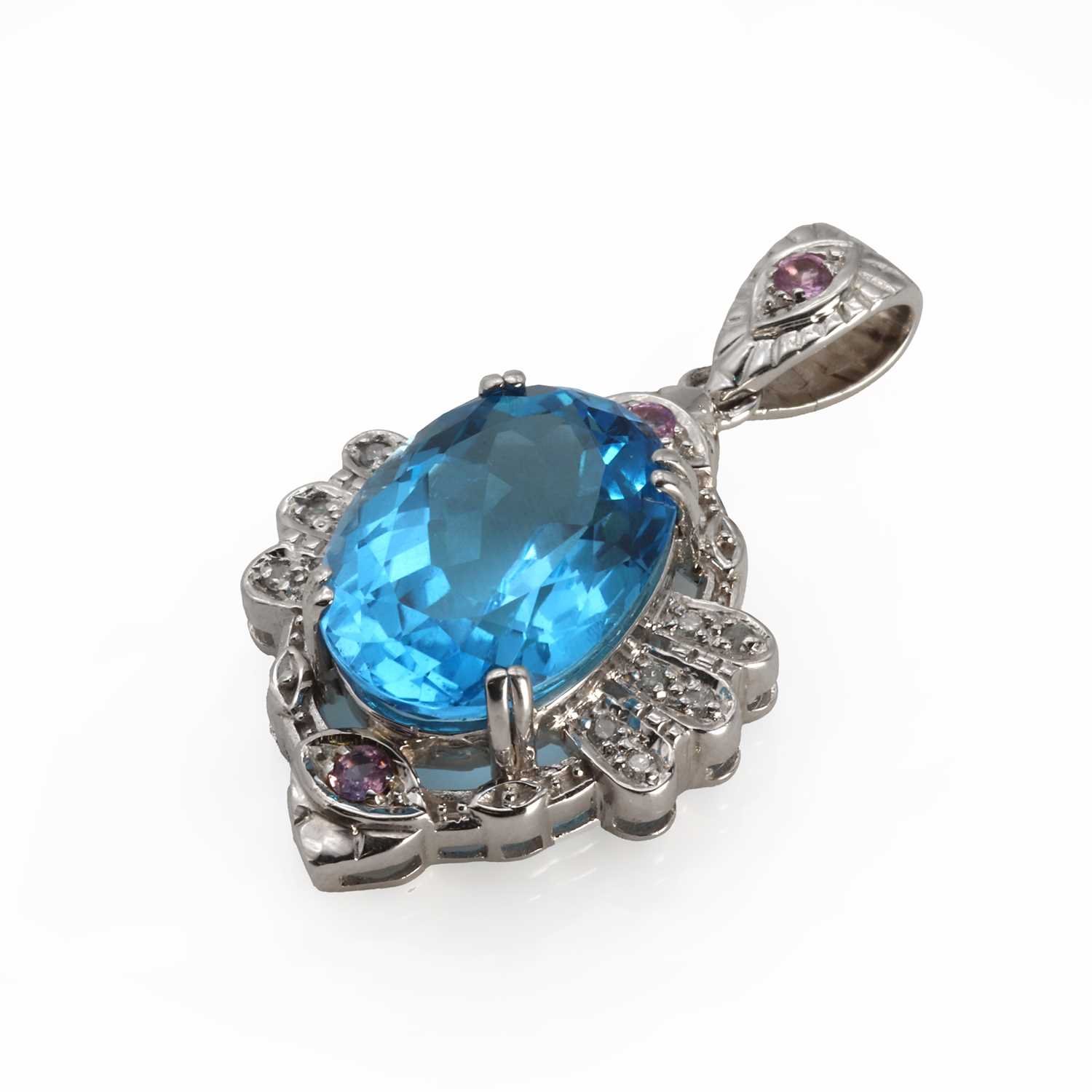 Lot 1149 - A 9ct white gold topaz, diamond and sapphire pendant