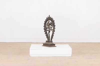 Lot 53 - A patinated brass figure of Shiva Natarāja