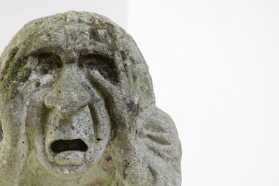 Lot 624 - A carved medieval-style stone head