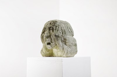 Lot 624 - A carved medieval-style stone head