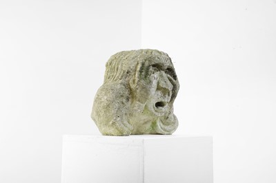 Lot 624 - A carved medieval-style stone head