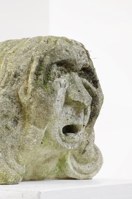 Lot 624 - A carved medieval-style stone head