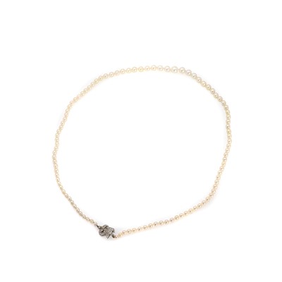 Lot 1210 - A single row graduated cultured pearl necklace with a diamond set clasp