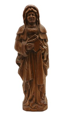 Lot 138 - A carved wooden saint