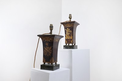 Lot 159 - A pair of painted and parcel-gilt toleware lamps