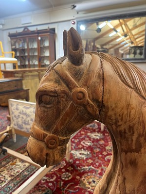 Lot 61 - A stripped teak pull-along horse