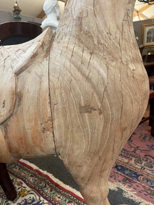 Lot 61 - A stripped teak pull-along horse