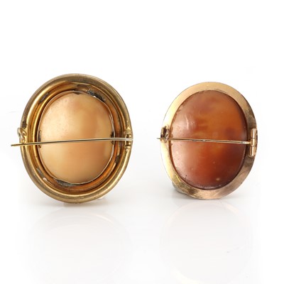 Lot 145 - A cameo brooch depicting a country scene, and another with a seated figure