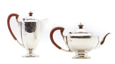 Lot 25 - A silver hot water and teapot