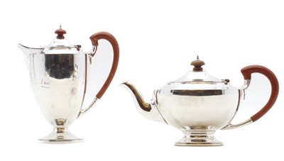 Lot 25 - A silver hot water and teapot