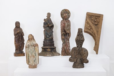 Lot 93 - A group of carved wood saints and architectural fragments