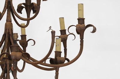 Lot 450 - A wrought-metal sixteen-light chandelier