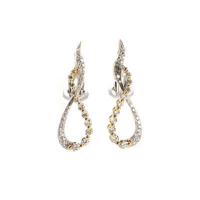 Lot 1058 - A pair of 18ct gold two colour gold diamond earrings