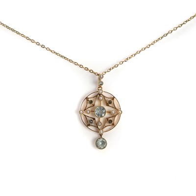 Lot 1035 - A gold split pearl, topaz and aquamarine drop pendant