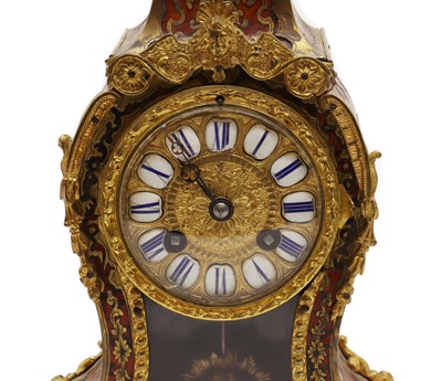 Lot 273 - A faux tortoiseshell and gilt-metal Boulle mantel clock