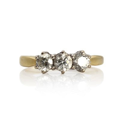 Lot 1086 - An 18ct gold diamond three stone ring