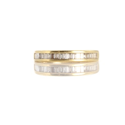 Lot 1047 - An 18ct gold half eternity ring