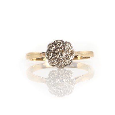 Lot 1080 - A gold diamond flowerhead cluster ring