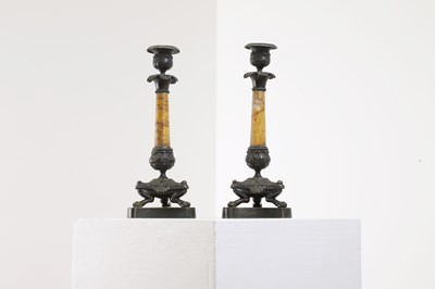Lot 96 - A pair of Empire bronze and Siena marble candlesticks